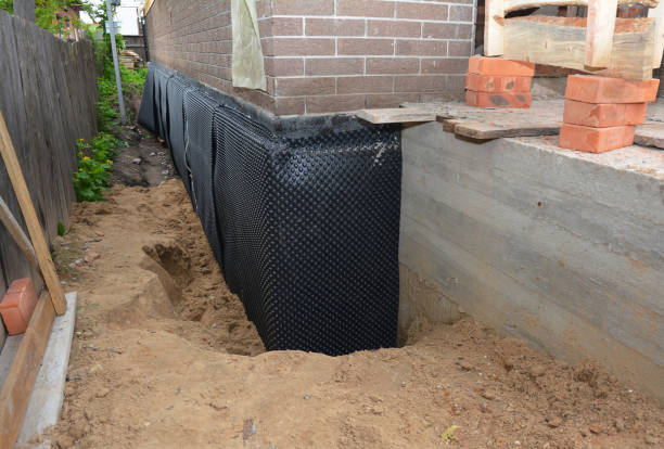 Happy homeowners after waterproofing job in Perrysville